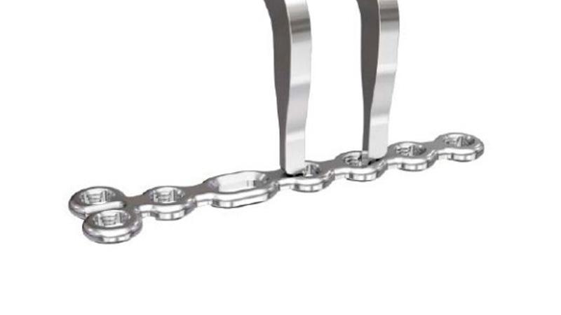 Variable Angle Locking Hand System plate holder placed in adjacent holes on plate