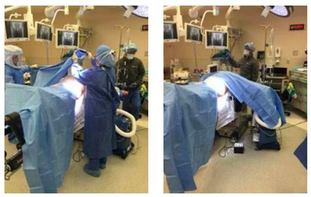 surgeons draping patient for anterior approach total hip replacement on Hana table