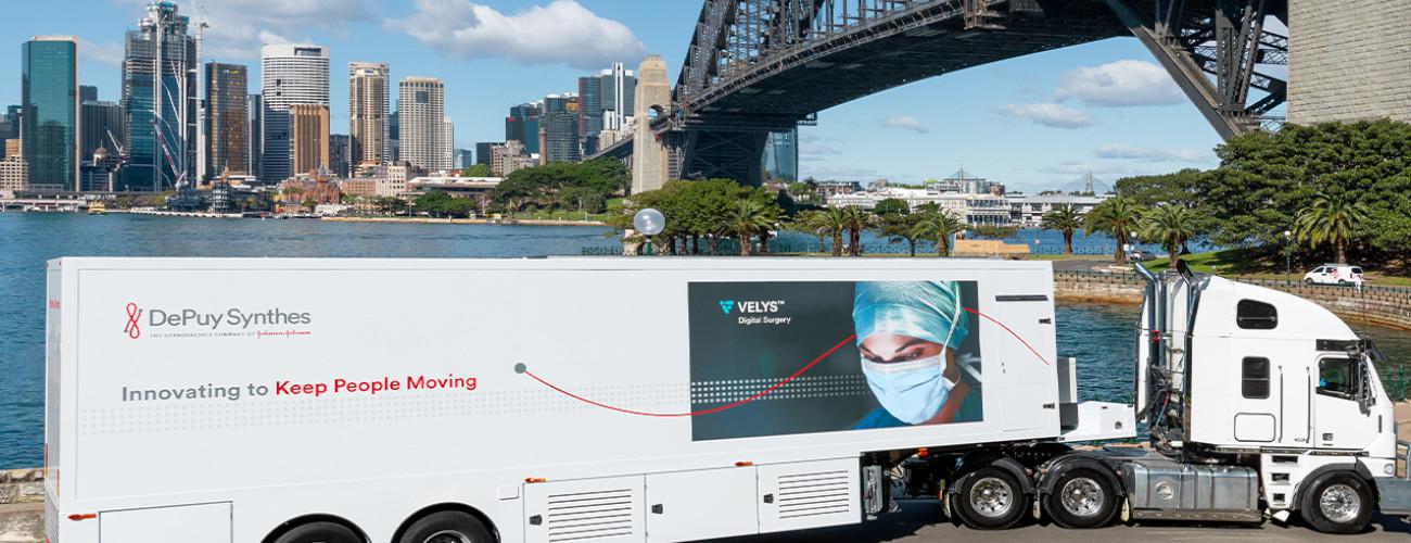  VELYS truck passes Sydney Harbour
