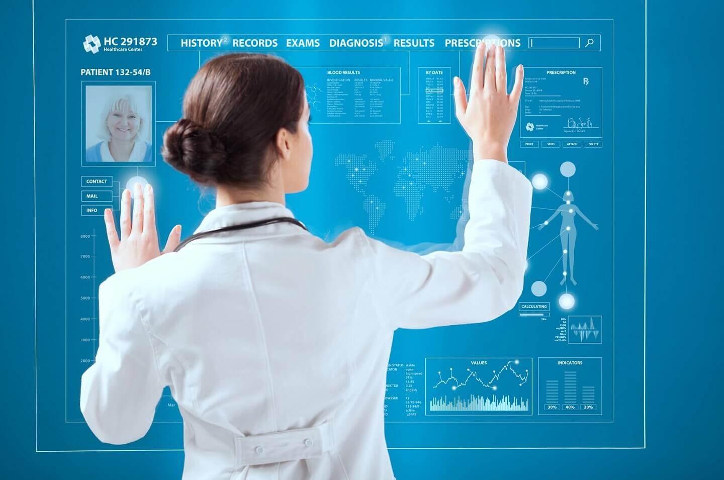 Woman doctor standing in front of a digital screen